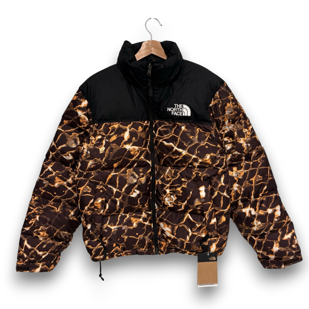 vsresell The North Face 700 Nuptse down jacket in a brown and black marble print with a high collar and front zip.